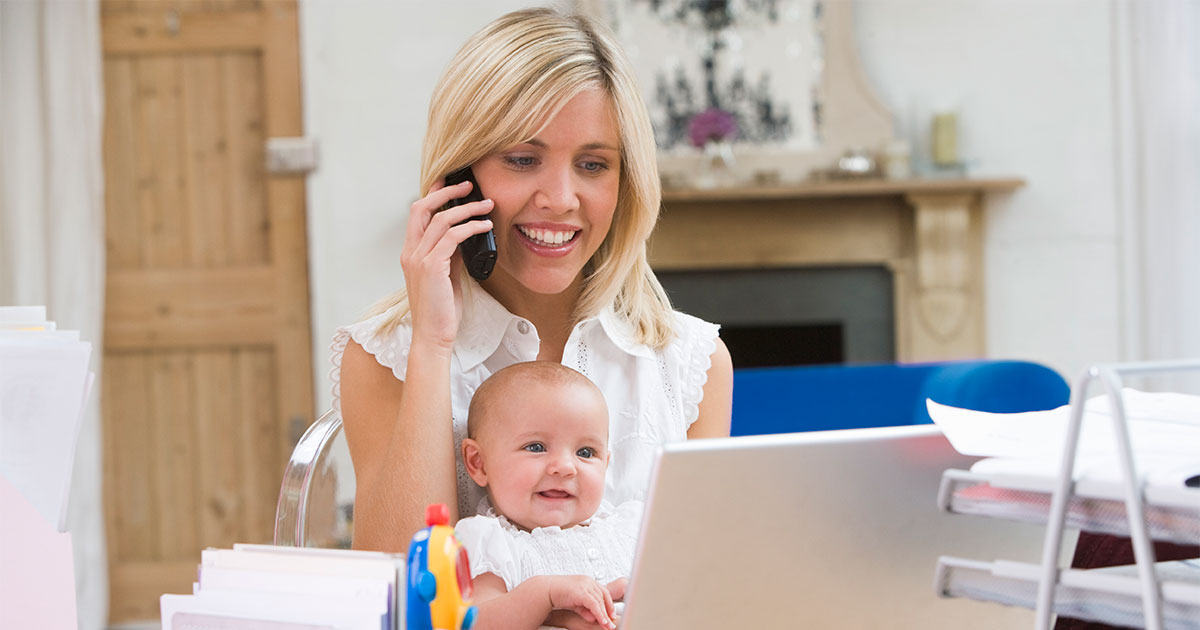 woman with baby talking on the phone